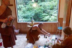 The sangha giving the Chao Khun kuti a deep clean.