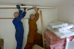 James and Ajahn Jo carefully removing scotia from the Garden kuti. The space is changing. The stepped floor left will be removed and the whole on one level.