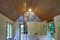Bruce in his not uncommon elevated and illuminated state preparing to reinstate the ceiling in the Raja kuti - having cleared the rats out of the roof! Relocated kitchen visible through the doorway.