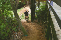 Richard delivering the last barrow load of dirt to form the new access track to the Garden kuti.
