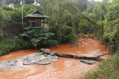 Our first rest shack with the river running red from some upstream excavations. It was a very cooling bath.
