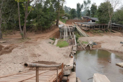 Royalty was on their way to open this bridge. A flash flood saved them the bother. This is the raft factory for tourist excursions down river.