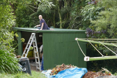 Bruce putting the finishing touches on a new storage shed.