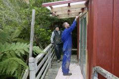 Bruce adapting to his new role of supervisor. Bryce putting some finishing touches to Architect kuti.