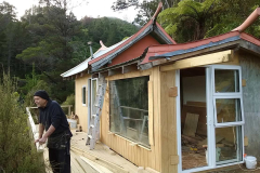 Bruce the builder looks out. Ajahn Kusalos old kuti has a new front.