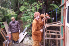 The wood box at the back of ajahn's kuti is demolished to salvage the wood.