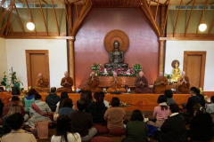The sangha chant parittas.
