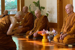 Taking the samanera refuges and precepts.