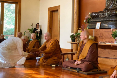 Anagarika Jet receives his samanera robes from Ajahn Kusalo.
