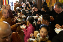 The sangha go on rice pindapat.