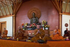 The Sangha chant parittas.