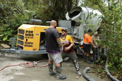 The concrete pumping guys are getting ready. Six cubic meters of concrete needs to go up the hill and around the corner.