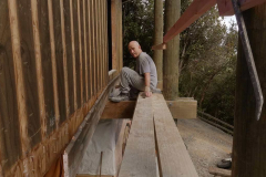 The baseboard outside the monks library is carefully peeled off for reuse.