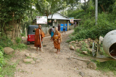 After pindapata we visit the local temple. The man in the blue sarong (carrying my bag) supports one of the kutis in the forest. He was very helpful.