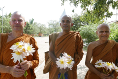 And here we are - the flower children - out to make offerings at the stupa.