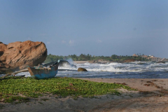 The fishermen's boat - and the surf they have to navigate to get out fishing. Kirinda temple - center right.