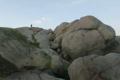 The rocks are big - the monk is small.