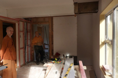 The vihara limited-mobility kuti taking shape. Bruce is standing in the old cupboard door - which will be walled off.