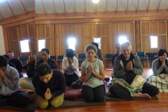 Ajahn Thitasippo gives a liberal liquid blessing to the new year retreatants.