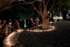 New years eve - just before midnight and the retreatants plant their aspirations under the wishing tree.