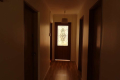 The ground floor entrance of the monks vihara. The leadlight was added to the existing door.