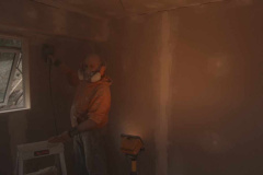 Aj Ks new office being sanded ready for painting. It that Darth Vader on the job - or just Bruce in costume?
