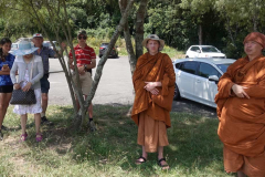 Katie Sita Trevor Chris Buddhisaro and Thitasippo waiting in the shade ready to explore the Waikato River.