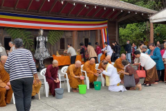 The Buddha rupas - and the Sangha - get generous blessing from all our lay friends that have come to celebrate Songkran.