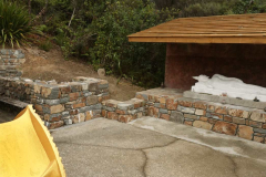 It has been a long time waiting but the landscaping work at the stupa is back on schedule. The area left will be planted with ground cover and the rock J section just above the golden alcove will get a nice big tree.