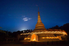 Stupa circumambulation with a clear moon rising.