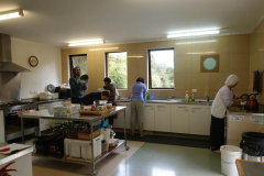 The home team busy in the kitchen.