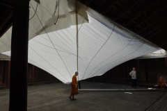 The canopy edges are secure and all is ready to raise the pole.