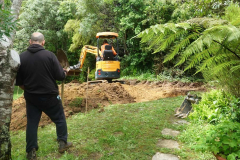 Clearing a platform for Aunty Suans new kuti in the lay resident zone.