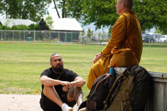 Tudong: By the lake at Rotorua. One of our kind food donors sharing some dhamma.