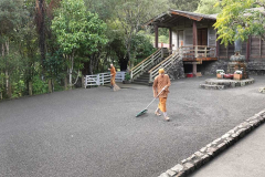 The courtyard is cleaned and raked.