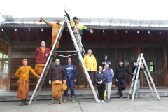 The new canopy is secured and the team poses prior to tea.