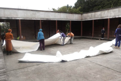 The NEW cloister canopy is unfurled for the first time. Which way is up?