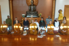 The re-elected committee with the sangha after the AGM.