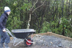 Rod wheels his wheelbarrow -