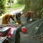 Vivienne and Claire help load the trailer to deliver gravel for the new hermitage track.