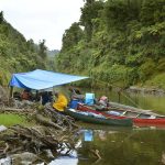 Cyclone Pam mostly passed us by but we had rain on the 17th and took lunch on a small gravel beach. Large driftwood logs gave fixing points to rig a roof.