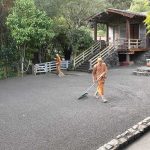 The courtyard is cleaned and raked.