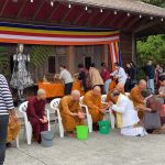 The Buddha rupas - and the Sangha - get generous blessing from all our lay friends that have come to celebrate Songkran.
