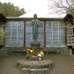 The standing Buddha rupa in the forecourt.