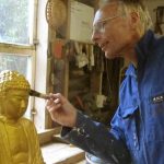 Pat puts the final touches to the "Rupa on a Rock".