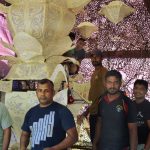 The streets of Colombo are busy with Vesak preparations. An army commando team building a lantern.
