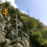 A steep descent down Paritutu rock.