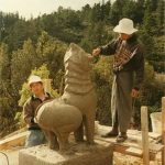 The Burmese craftsmen working on the entry lions.