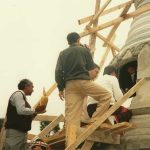 Relics and sacred objects being added to the stupa.