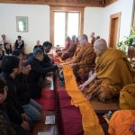The cloth is offered to the Sangha.